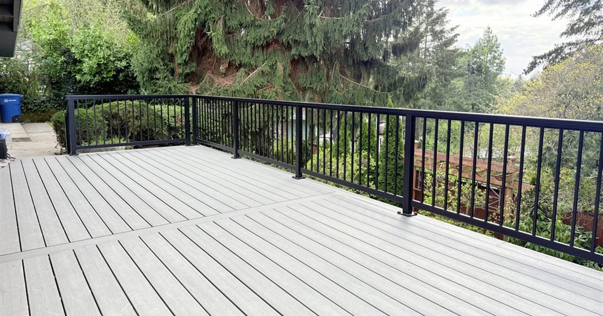 Gray composite deck with black aluminum railing in Seattle, a typical Trex vs TimberTech decision for PNW homeowners